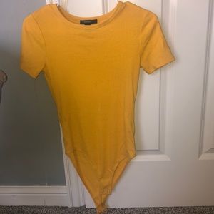 Bright yellow body suit
